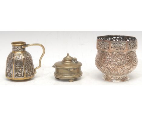A Middle Eastern silver and copper damascened brass flagon, decorated in the Islamic taste, 8cm high; a Kahmiri silvered copp