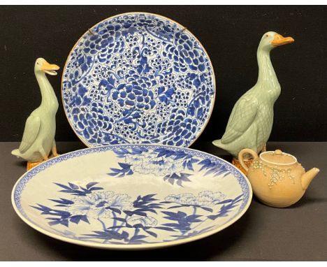 A Japanese blue and white dished charger, painted with blossoming prunus, 34.7cm diameter, another 40.5cm;  pair of Ducks etc