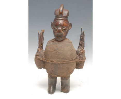 Tribal Art - a Yaka m'bwoolo fetish figure, stylised features with upturned nose, bound in cloth and attorned with sticks, 37
