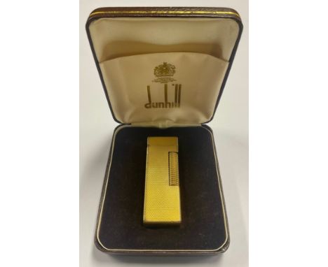 A Dunhill gold plated lighter, cased, 6.5cm long
