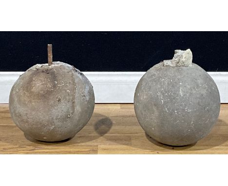 A pair of stone globular gate post pier caps or finials, 25cm diameter (2)