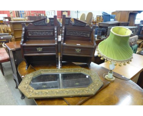 A brass octagonal framed mirror, an onyx table lamp and a pair of dressing table mirror stands 