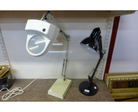 A black metal anglepoise lamp and a Luxo magnifier 
