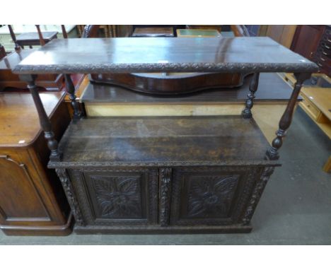A Victorian Jacobean Revival carved oak buffet 