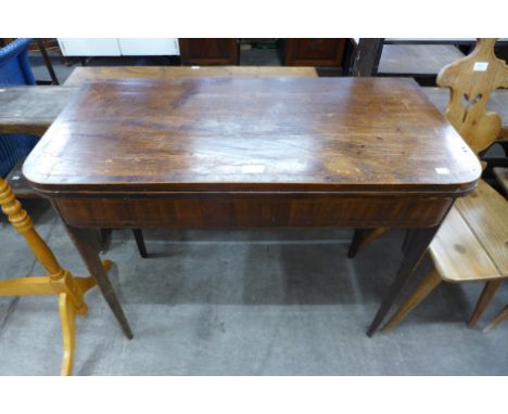 A George III inlaid mahogany fold over card table 