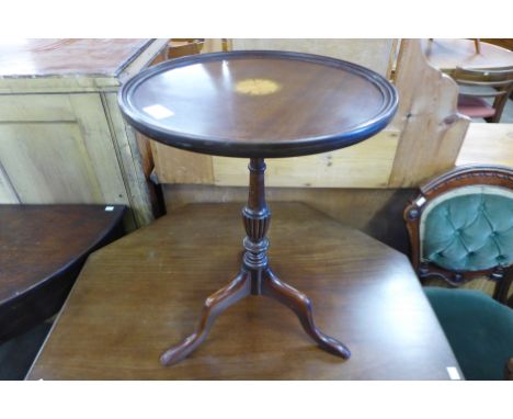 An inlaid mahogany tripod wine table 