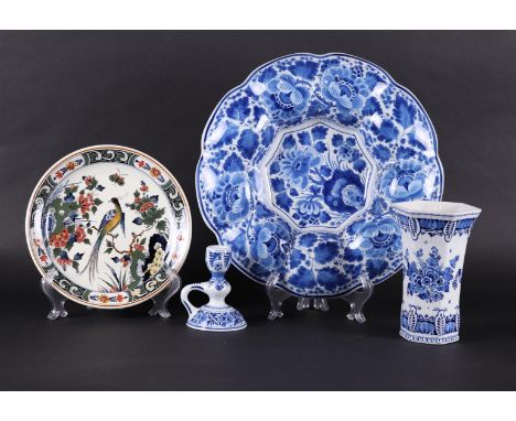 A lot of pottery consisting of a polychrome plate, a cupboard vase, a candlestick and a folding dish. All marked: "De Porcele