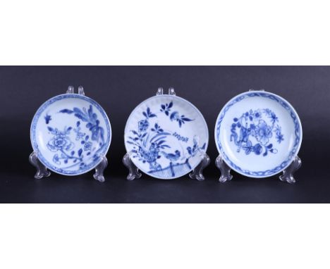 Three various porcelain plates with floral decor, one with two roosters decoration. China Kangxi/Yongzheng.Diam. 11 & 11.5 cm