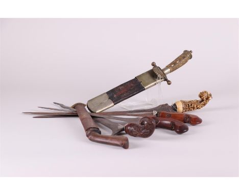 A collection of (4) Indonesian krisses in various conditions, a small Luwuk knife, and a hunting dagger.
