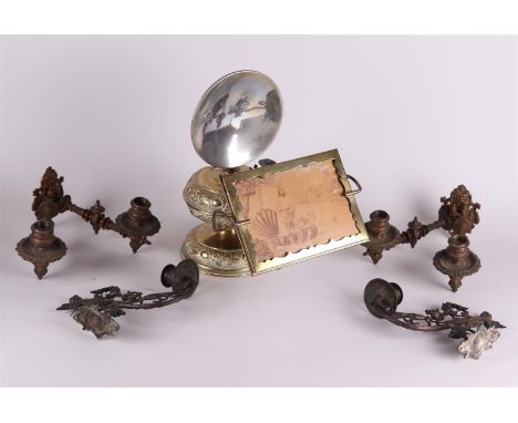 A lot consisting of two sets of brass piano candles and a piano lamp. Late 19th century.