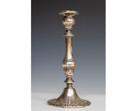 A sterling silver candlestick, 19th century. Gross weight 510 grams. (stuffed up).H.: 24 cm. 