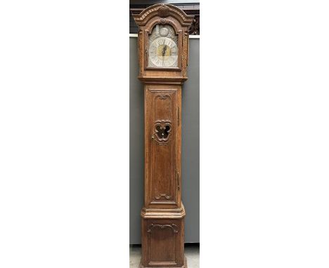 A richly carved so-called: "Liege clock", carved oak cabinet with LXVI motifs. A Masonic sign in the pendulum hole. Movement 