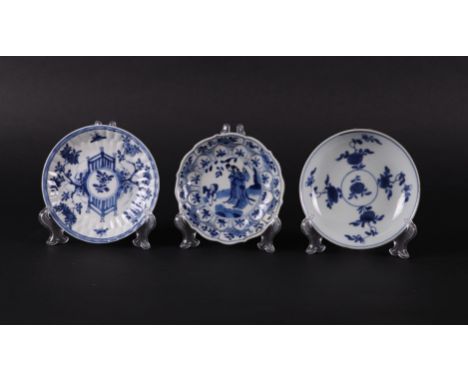 Three different porcelain plates with floral decor, with fence and insect decor and with frostings and fool decor. China, Kan