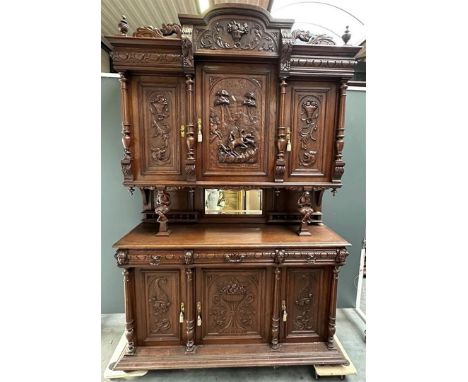 A French antique hunting cabinet with a deer hunt worn on the uprising by jesters. The lower doors with cornucopias. about 18