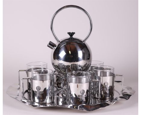 A design tea set consisting of a WMF teapot with tea light holder and Alessi tea mugs.