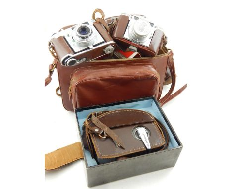 A Kodak Retinette 45mm camera, circa 1950, together with a Paxette camera, a Bell & Howell 8mm cine camera, a tan leather cas