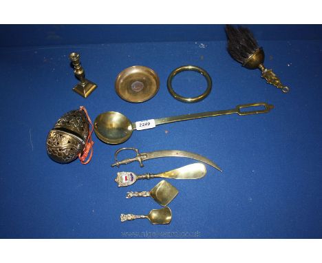A small quantity of brass items including large spoon, candlestick, shoe horn, caddy spoon, etc.