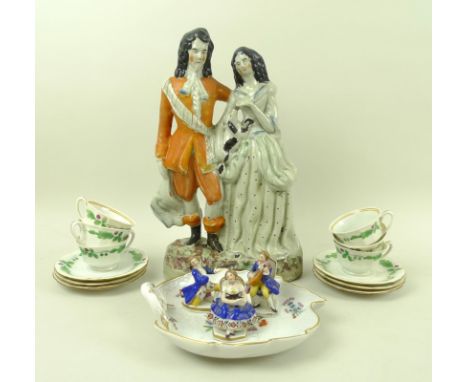 A collection of ceramics, comprising a large Staffordshire figure of a Scottish couple, 31.5cm, a set of six small cups and s