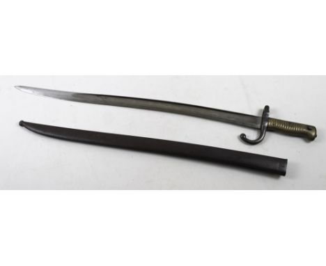 A 19th century French Gras bayonet and scabbard, blade engraved St. Etienne 1872, with P35865 to the guard and to the scabbar