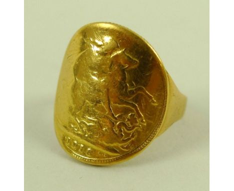 A George V gold sovereign, 1918, curved and mounted into a ring, size R, 10.6g. 