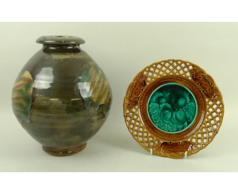 A studio pottery vase, decorated in dark tones, 28 by 21cm, together with a ceramic bi-colour glaze plate, decorated with pea