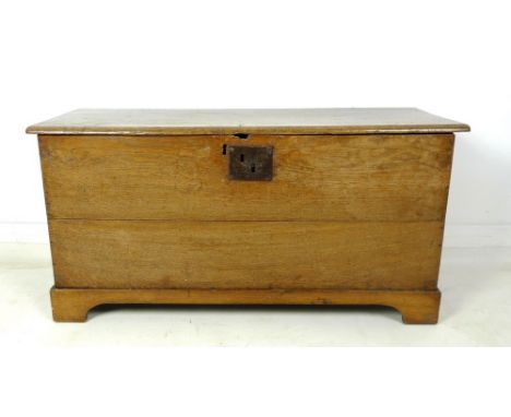 An 18th century oak blanket chest, lift lid, with replacement bracket base, 98 by 36 by 50cm high.
