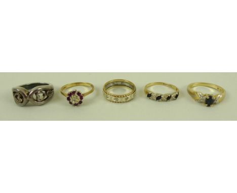 A group of three 9ct gold rings, comprising a diamond and sapphire ring, a ruby and diamond ring, boxed, and a diamond studde