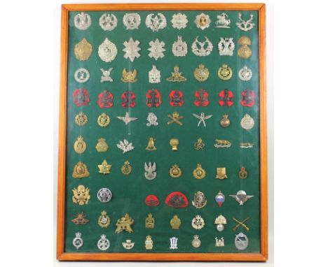A collection of cap badges, arranged in a framed display case, to include regimental cap badges, metal and staybright, Royal 