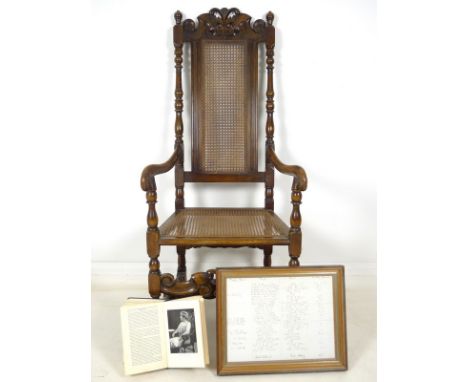 A 19th century hall chair, stained mahogany and beech, with caned back and seat, turned supports and scroll carved, ball fini