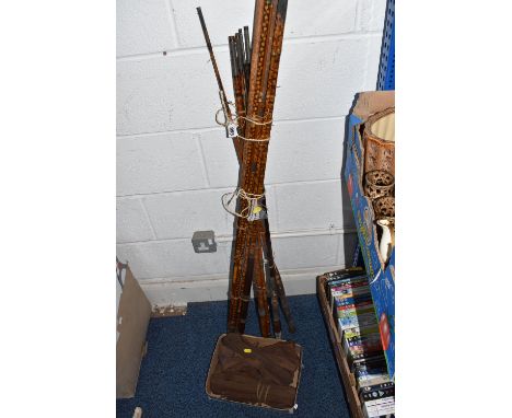 A GROUP OF FIVE VINTAGE FISHING RODS AND COVERS to include a four-piece cane 'spotted patterned' rod with a cork handle (part