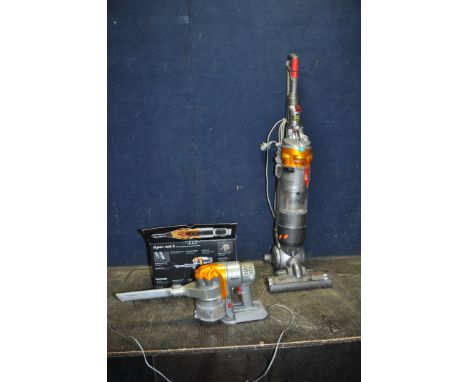 A DYSON DC18 ALL FLOOR UPRIGHT VACUUM CLEANER, and a DC16 Root 6 cordless vacuum cleaner with bracket and charger (both PAT p