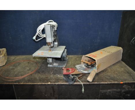 A VINTAGE BAND SAW, with a 30cm throat (PAT pass and working) along with spare blades and a box containing various saws
