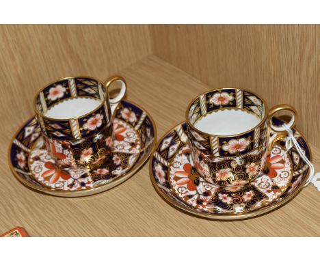 TWO ROYAL CROWN DERBY IMARI 2451 COFFEE CANS AND SAUCERS, with red printed backstamps and date cyphers for 1913 and 1925 (4) 
