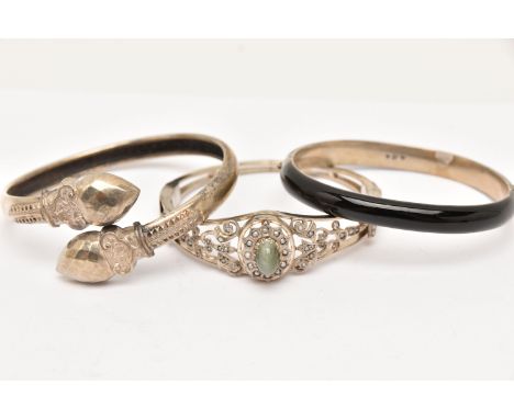 THREE VICTORIAN BANGLES, the first a white metal and black enamel hinged bangle, with star and seed pearl detail, an open wor