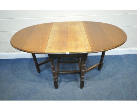 AN EARLY 20TH CENTURY OAK GATE LEG TABLE, open width 151cm x closed width 53cm x depth 92cm x height 77cm, along with a nest 