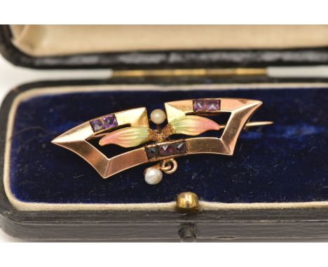 AN ART NOUVEAU ENAMEL BROOCH, a yellow metal brooch set with seven square cut amethyst, central enamel foliage detail and see