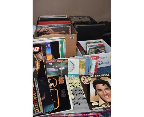 FOUR BOXES OF LPS AND SINGLES to include a large quantity of compilations and greatest hit titles comprising artists Elvis Pr