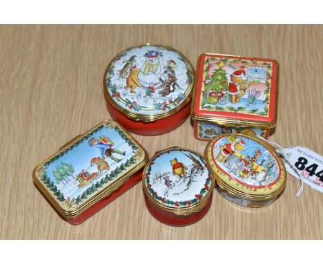 FIVE HALCYON DAYS 'WINNIE THE POOH' ENAMEL TRINKET BOXES, with a winter/Christmas theme, comprising 'It's all so much more fu