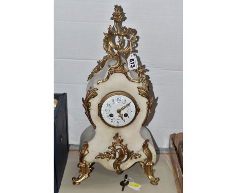 A NINETEENTH CENTURY FRENCH MARBLE AND ORUMLU MANTEL CLOCK with rococo scroll mounts to the top and either edge (some loose),