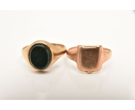 TWO 9CT GOLD SIGNET RINGS, the first set with an oval cut bloodstone inlay, hallmarked 9ct London, ring size T, the second of