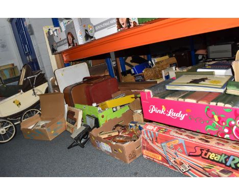 SIX BOXES AND LOOSE MISCELLANEOUS SUNDRIES AND BOOKS, to include a 1960's doll's pram, a collection of Corgi diecast play wor
