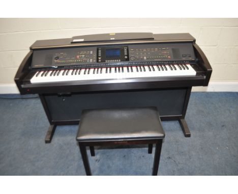 A YAMAHA CLAVINOVA CVP-305 ELECTRONIC PIANO, in a walnut effect cabinet total length 143cm, with a Yamaha piano stool (PAT pa
