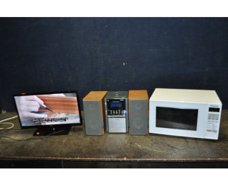 A LOGIK 20in TV, a Hitachi mini hi fi with matching speakers, and a Panasonic microwave (all PAT pass and working but hi fi c