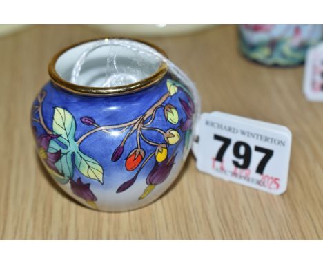 A MOORCROFT ENAMELED 'BITTERSWEET' TRINKET VASE with multi-coloured buds and purple flowers, of bulbous form and a brass rim,