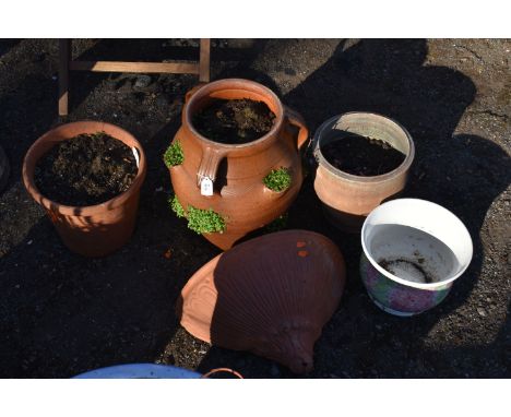 A GLAZED TERRACOTTA STRAWBERRY POT, three terracotta plant pots, and ceramic pot, condition report: wall plant pot chipped to