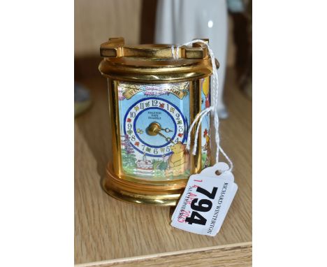 A LIMITED EDITION HALCYON DAYS ENAMEL WINNIE THE POOH '80TH ANNIVERSARY' CARRIAGE CLOCK in gilt metal and brass cased timepie
