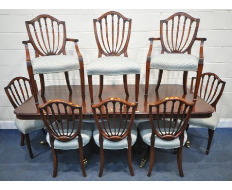 MANOR HOUSE FURNITURE, A REPRODUCTION MAHOGANY TWIN PEDESTAL EXTENDING DINING TABLE, with a cutlery drawer to one end, with g