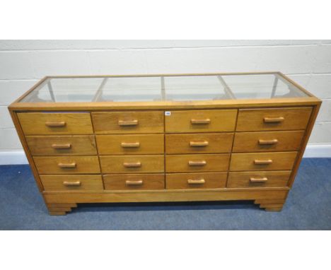 DUDLEY AND CO LIMITED, SHOWCASE MANUFACTURERS, HOLLOWAY, LONDON, N.7, AN ART DECO HABERDASHERY COUNTER, fitted with four rows