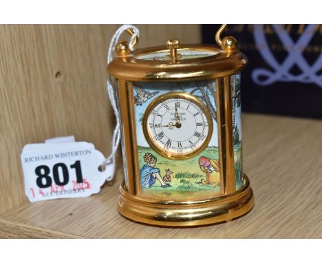 A HALCYON DAYS ENAMEL WINNIE THE POOH CARRIAGE CLOCK in gilt metal and brass cased timepiece, compressed cylinder form, decor