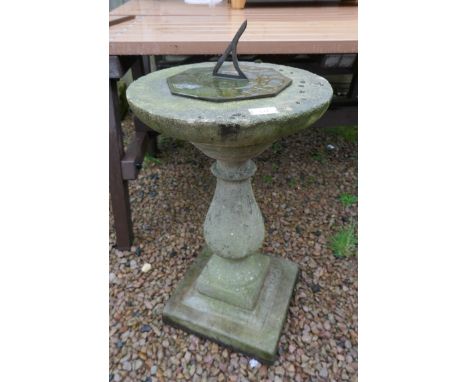 Stone sundial on plinth 